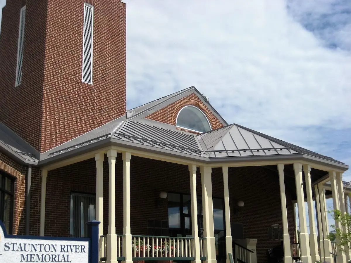 Skilled roofing craftsmen working on a residential roof in Saint Benedict